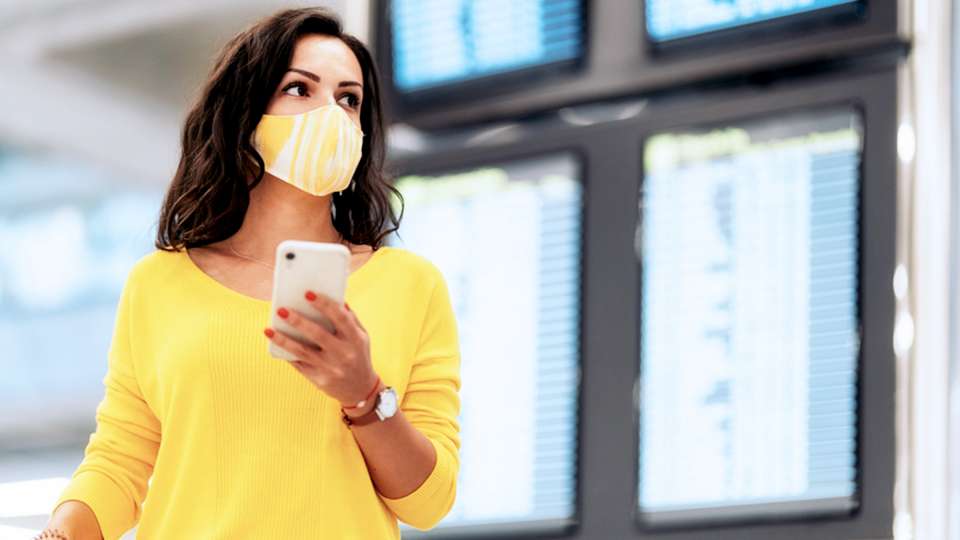 Woman in mask at airport