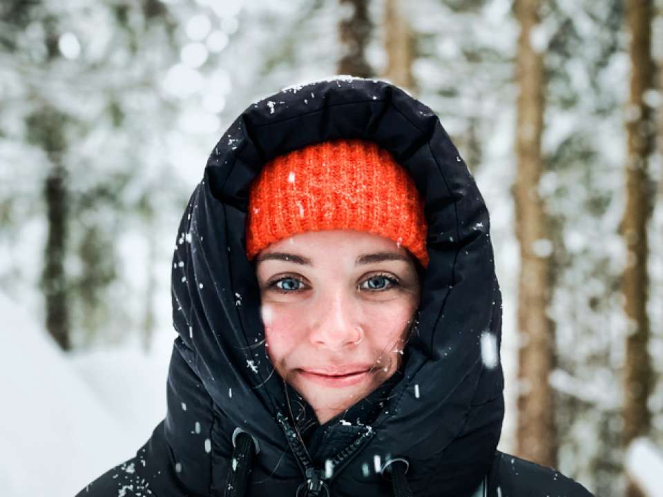 Woman smiling in snow