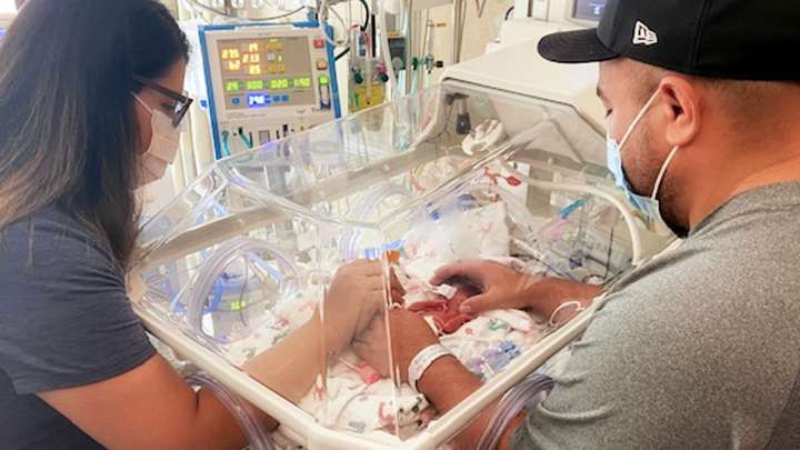 Lizet Robles and her husband with baby Savannah in the NICU.
