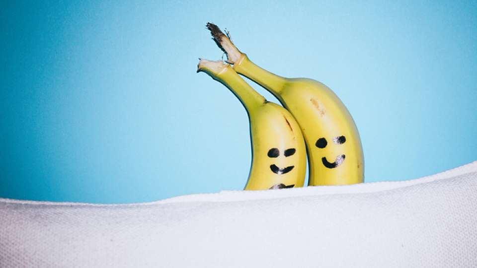 happy banana couple in bed