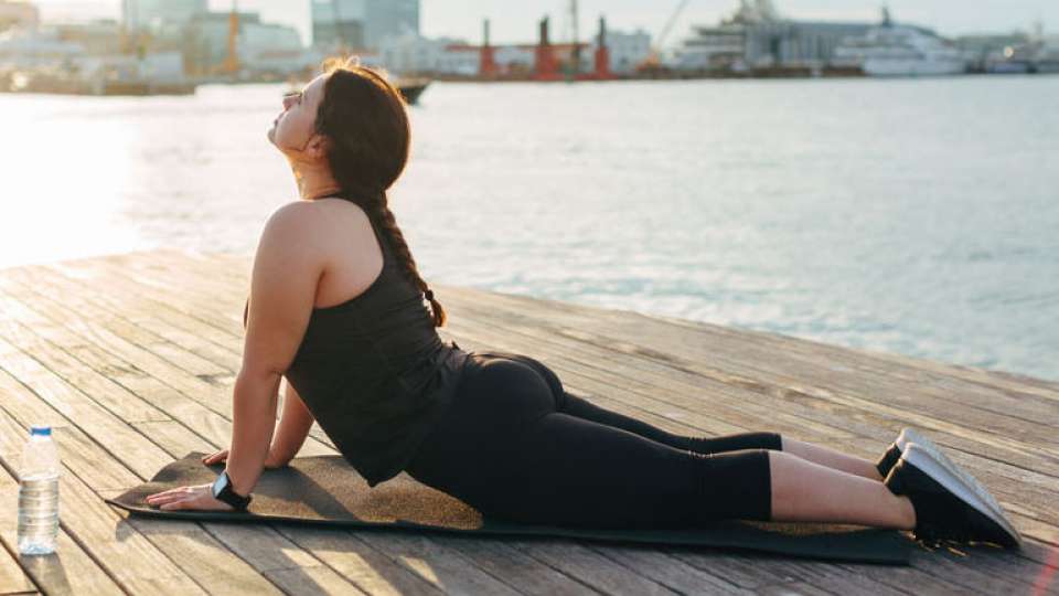 Woman stretching on dock
