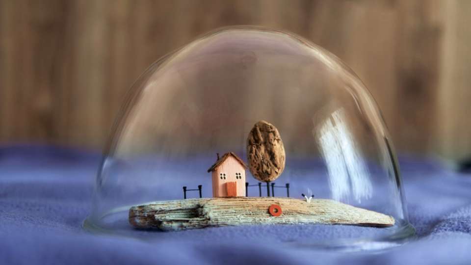 Miniature house in a bubble