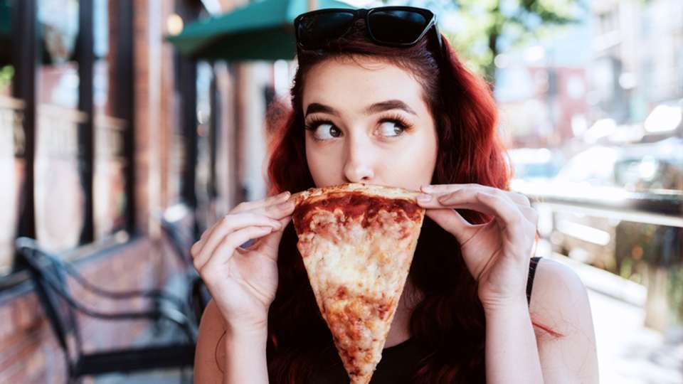 woman-holding-pizza