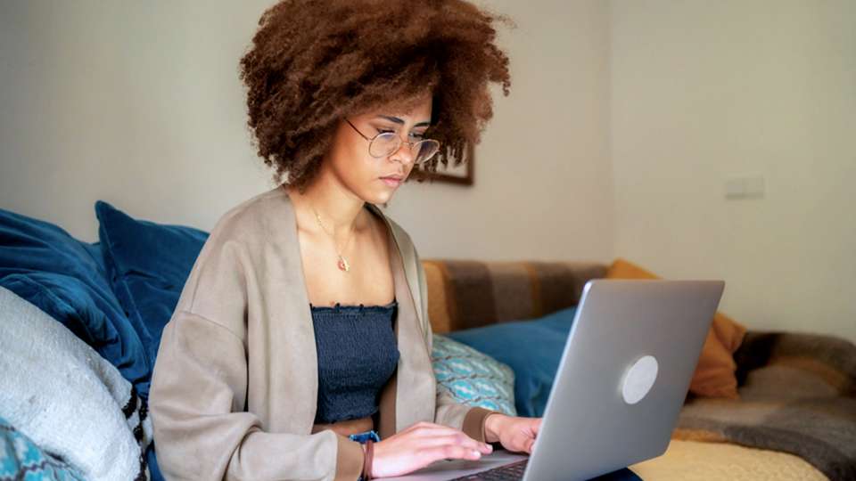 Woman works on a laptop