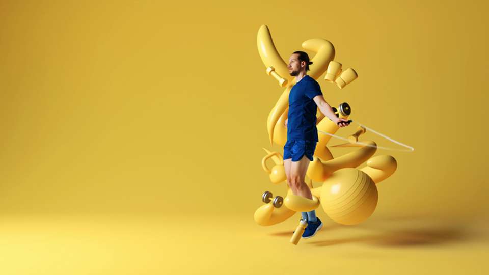 man with yellow objects swirling around him