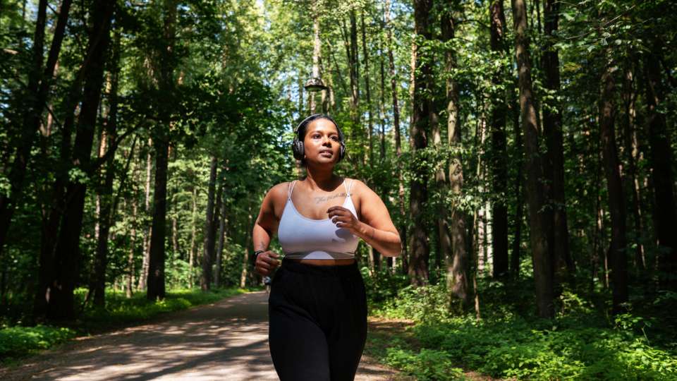 Woman running in the forest