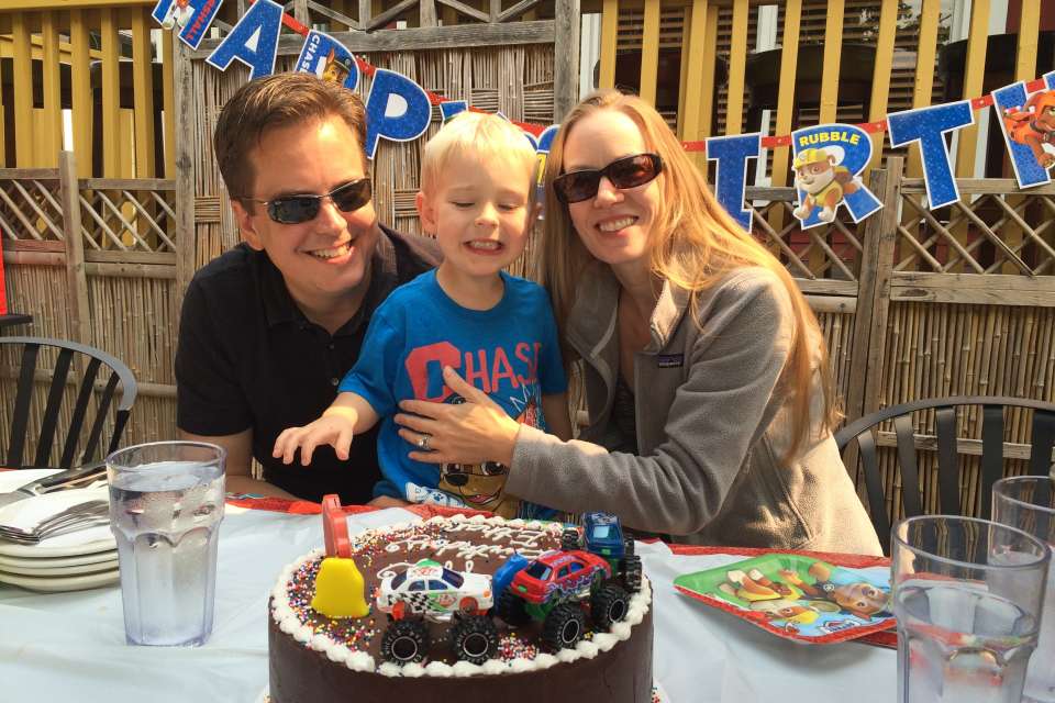 Lacey Siekas with her son and husband celebrating her son's birthday