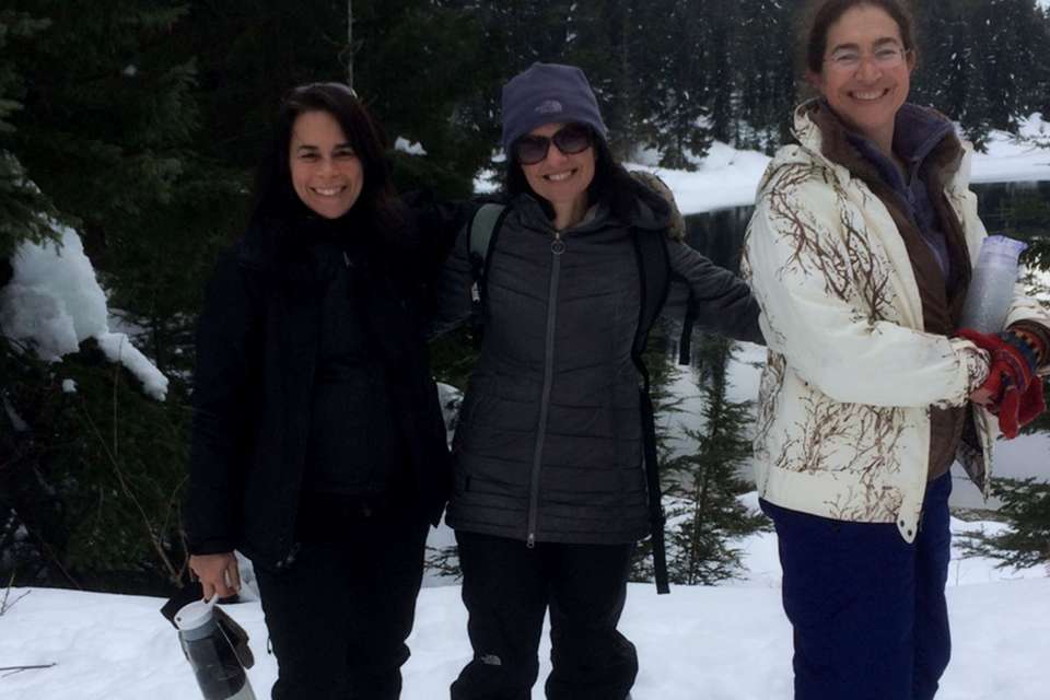 Cynthia Kertesz snowshoeing with two others