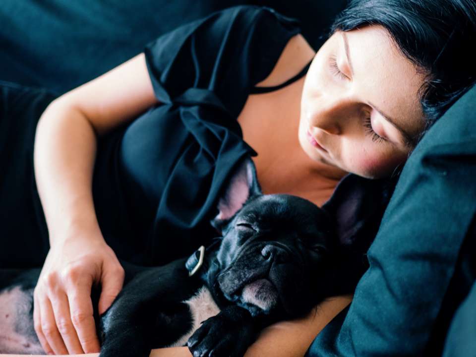 Woman asleep with dog