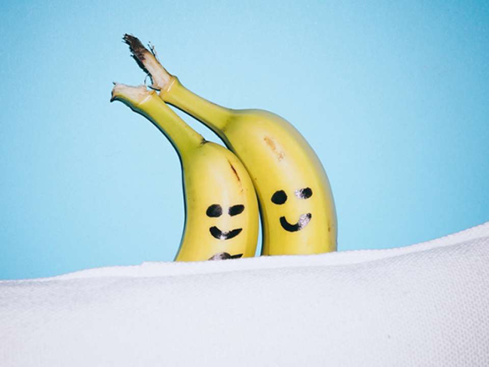 happy banana couple in bed