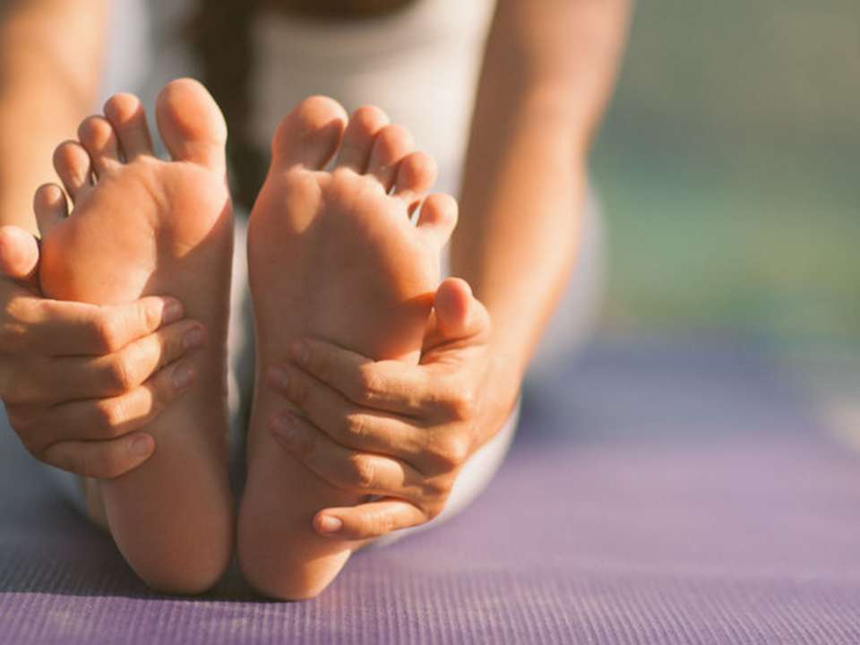 Feet on yoga mat
