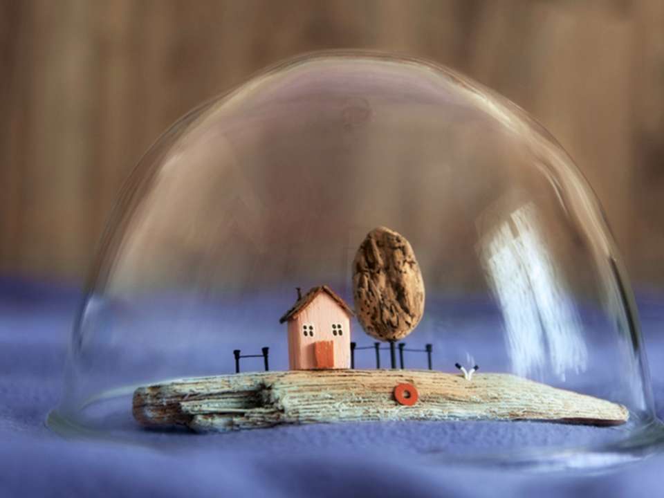 Miniature house in a bubble