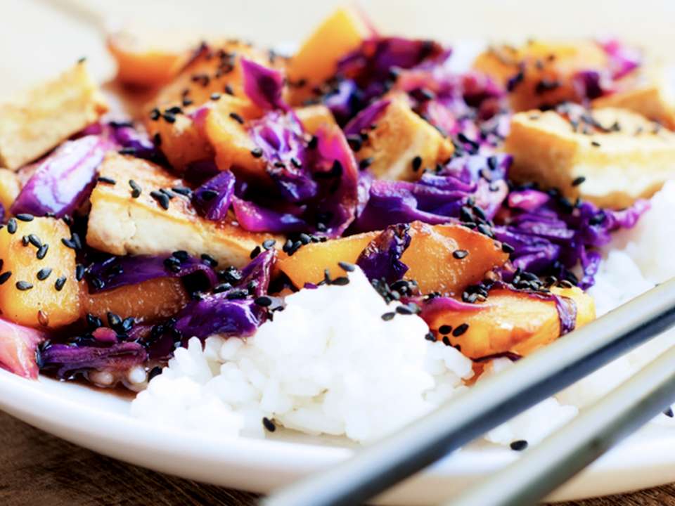 A meal of rice, purple cabbage, sweet potatoes and tofu.