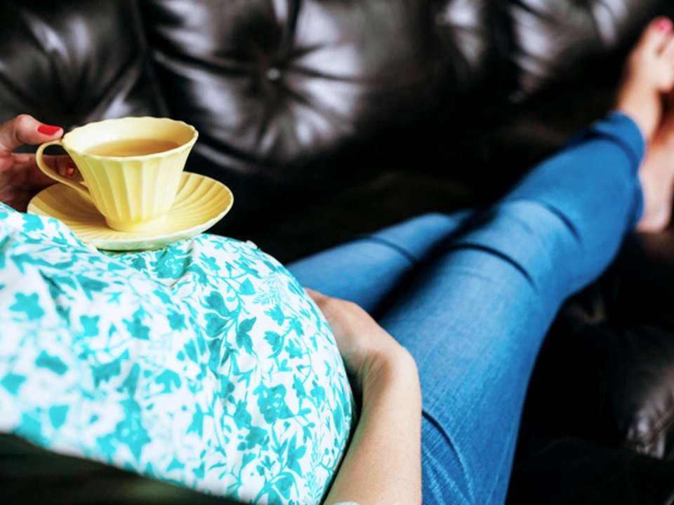pregnant-woman-holding-teacup