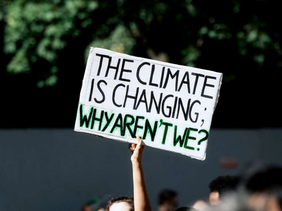 A protest sign that reads, "The climate is changing. Why aren't we?" 