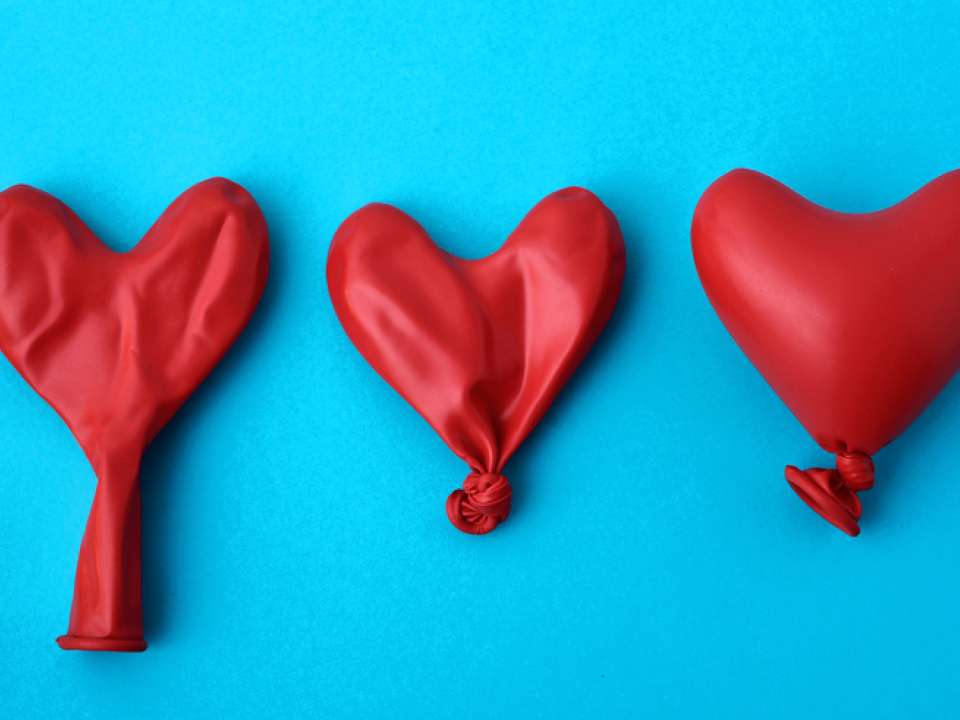 Three red heart balloons 